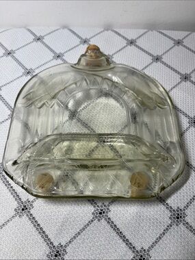 Tray or mat created by heating a glass bottle until it flattens
Unique